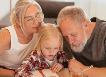 foster parents teaching young girl